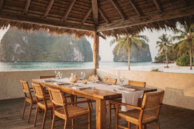 Illustrative beachfront dining from the fictional Hiraya Cove brand demo